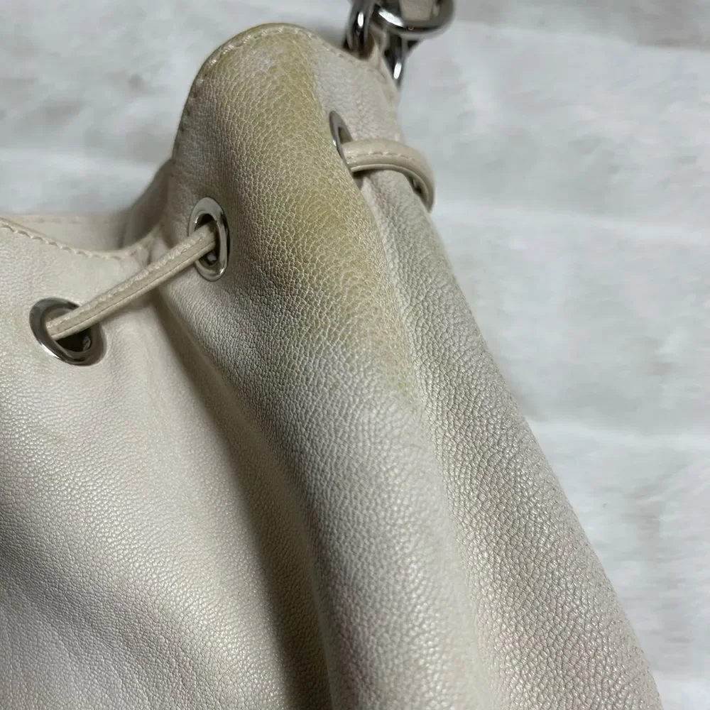 Michael Michael Kors leather beige drawstring bucket satchel.silver tone accents
